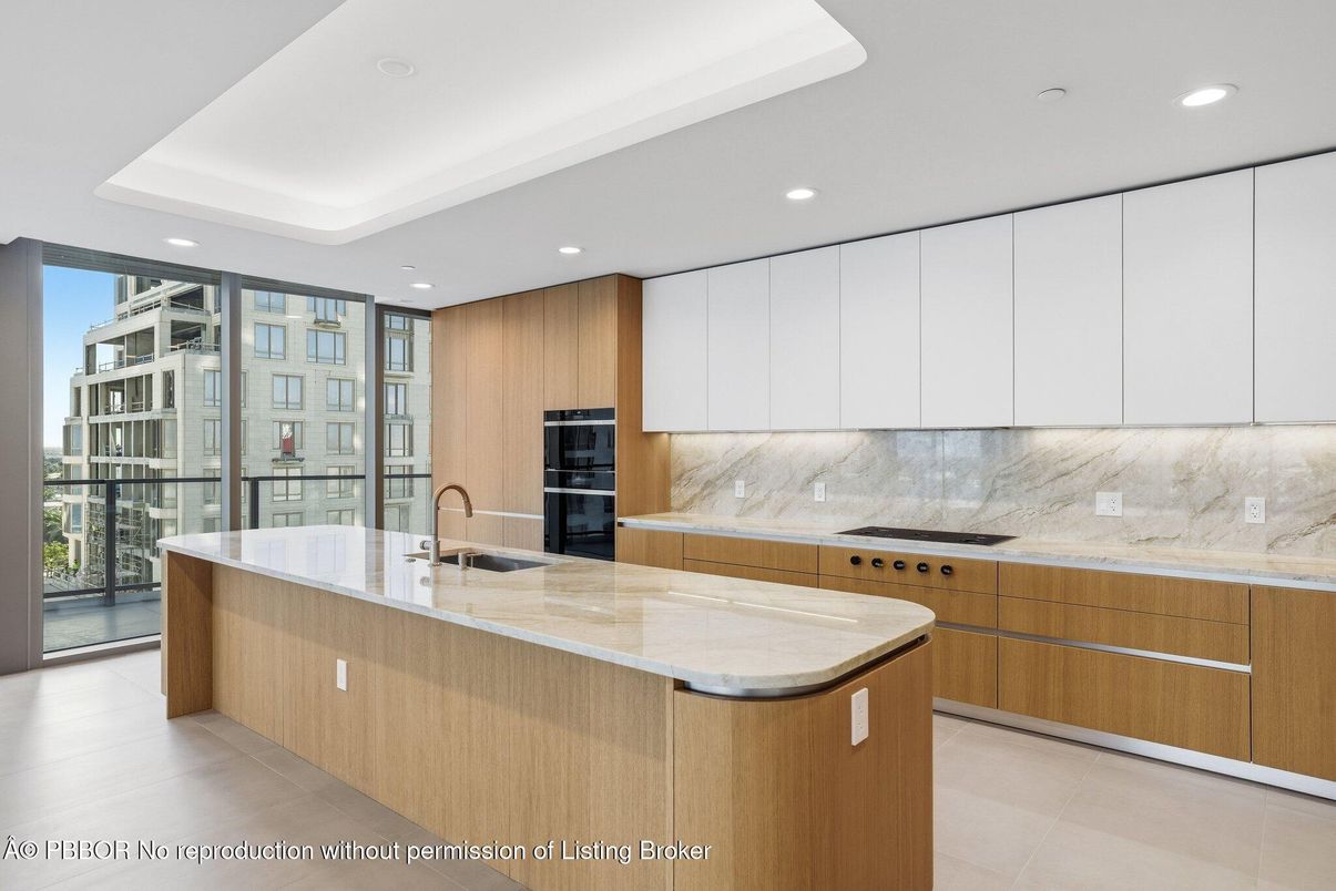 Interior, Kitchen, Marble Walls, Recessed Lighting, Stainless Steel Appliances