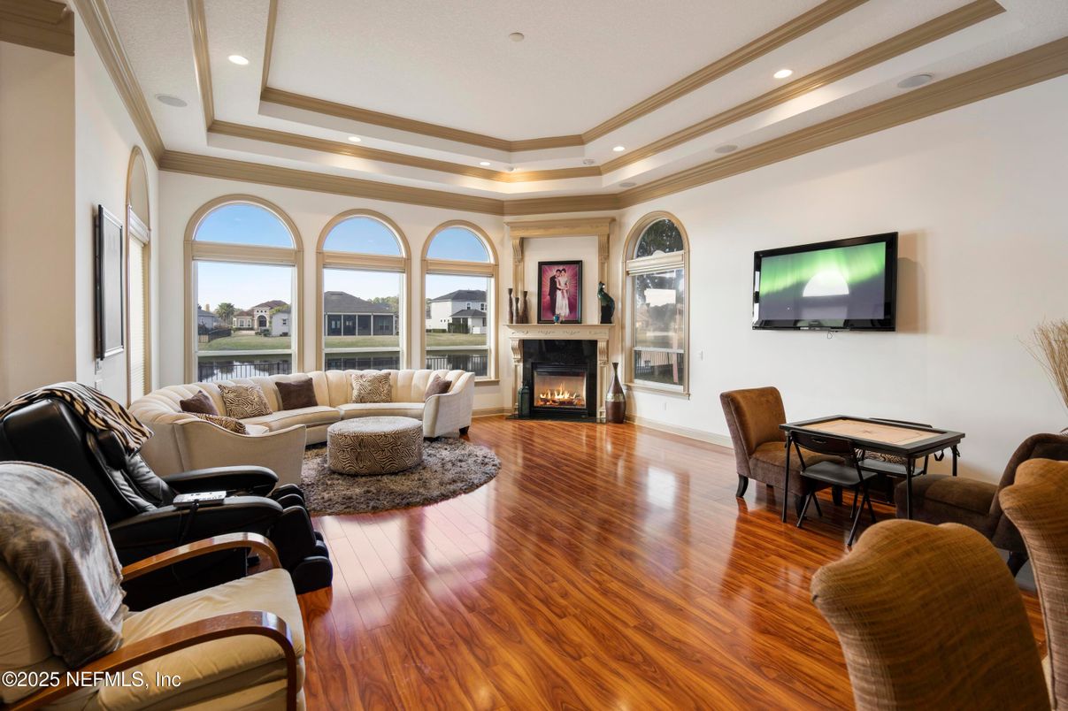Dining room, Fireplace, Interior, Living room, Recessed Lighting, Wood Texture Flooring