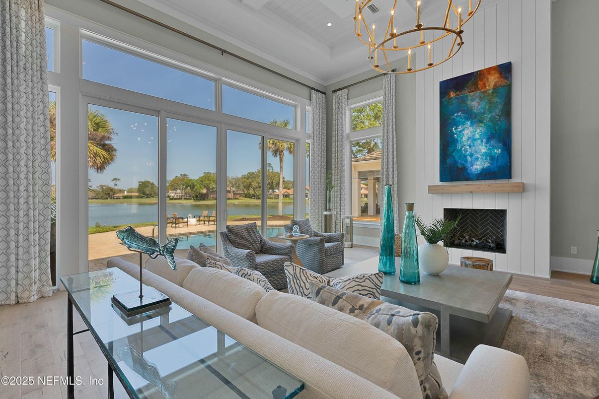 Chandelier, Fireplace, Interior, Living room, Recessed Lighting, Water, Wood Texture Flooring