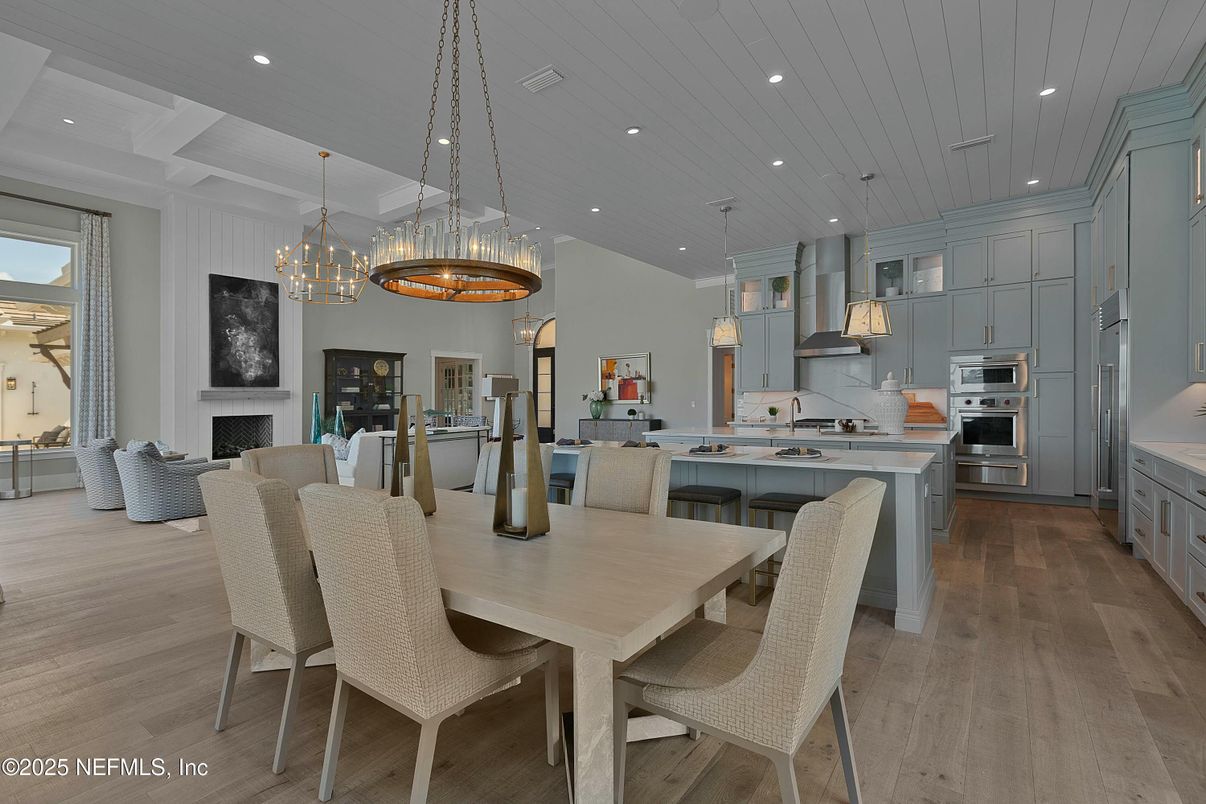 Chandelier, Dining room, Fireplace, Interior, Kitchen, Pendant Lights, Recessed Lighting, Stainless Steel Appliances, Wood Texture Flooring
