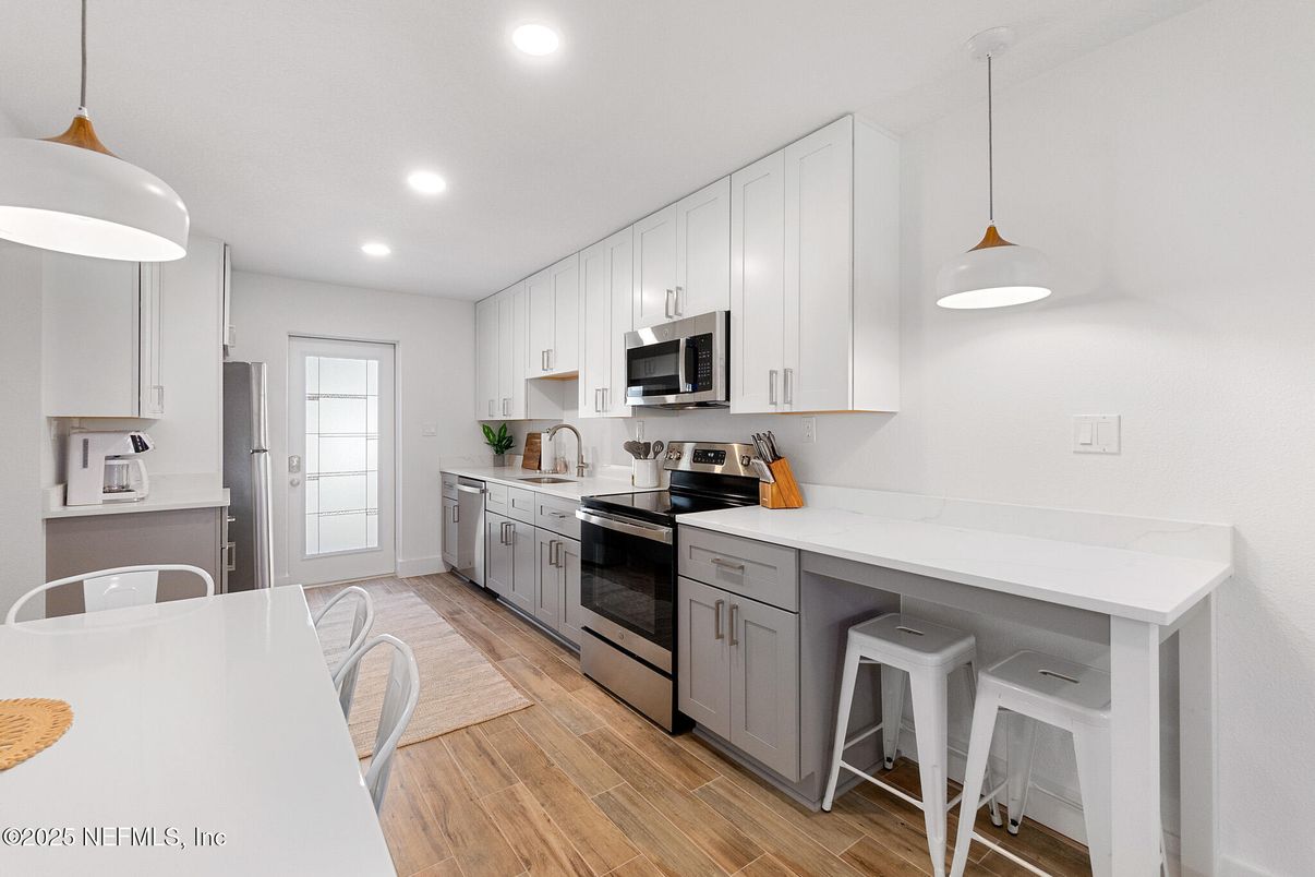 Interior, Kitchen, Pendant Lights, Recessed Lighting, Stainless Steel Appliances, Wood Texture Flooring