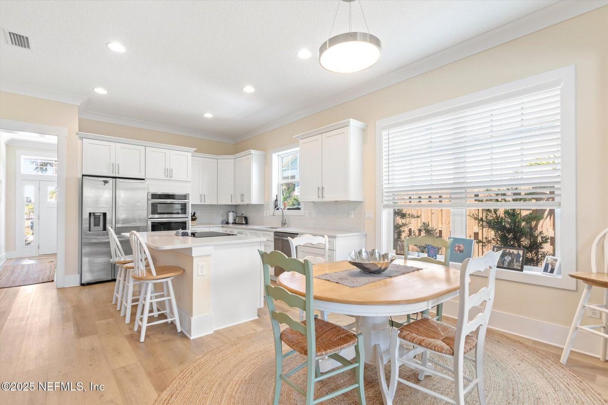 Dining room, Interior, Kitchen, Pendant Lights, Recessed Lighting, Stainless Steel Appliances, Wood Texture Flooring