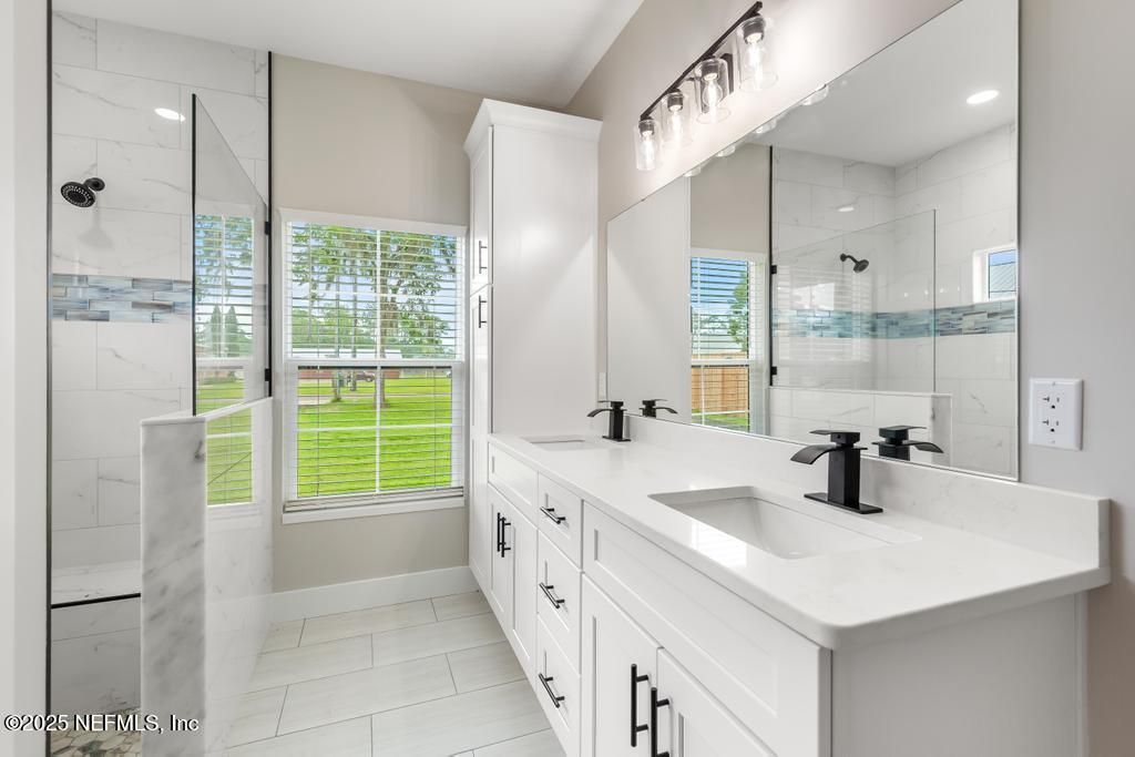 Bathroom, Dual Sink Vanities, Glass Shower, Interior, Marble Walls, Recessed Lighting