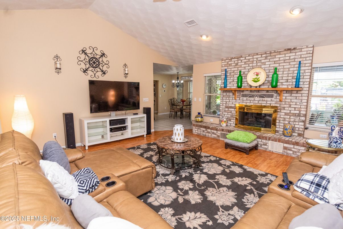 Chandelier, Dining room, Fireplace, Interior, Living room, Recessed Lighting, Stone Walls, Wood Texture Flooring