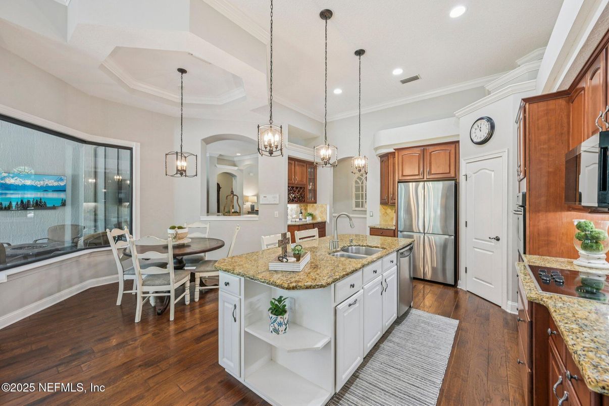 Dining room, Interior, Kitchen, Pendant Lights, Recessed Lighting, Stainless Steel Appliances, Wood Texture Flooring
