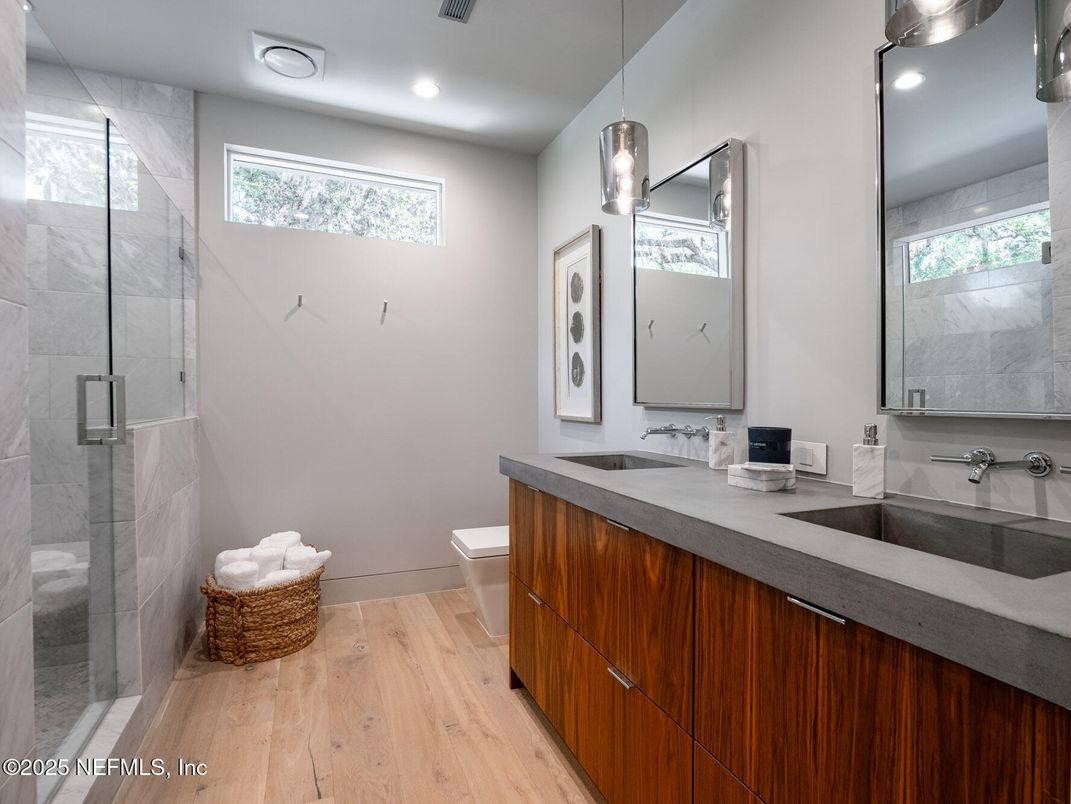 Bathroom, Dual Sink Vanities, Glass Shower, Interior, Pendant Lights, Recessed Lighting, Wood Texture Flooring