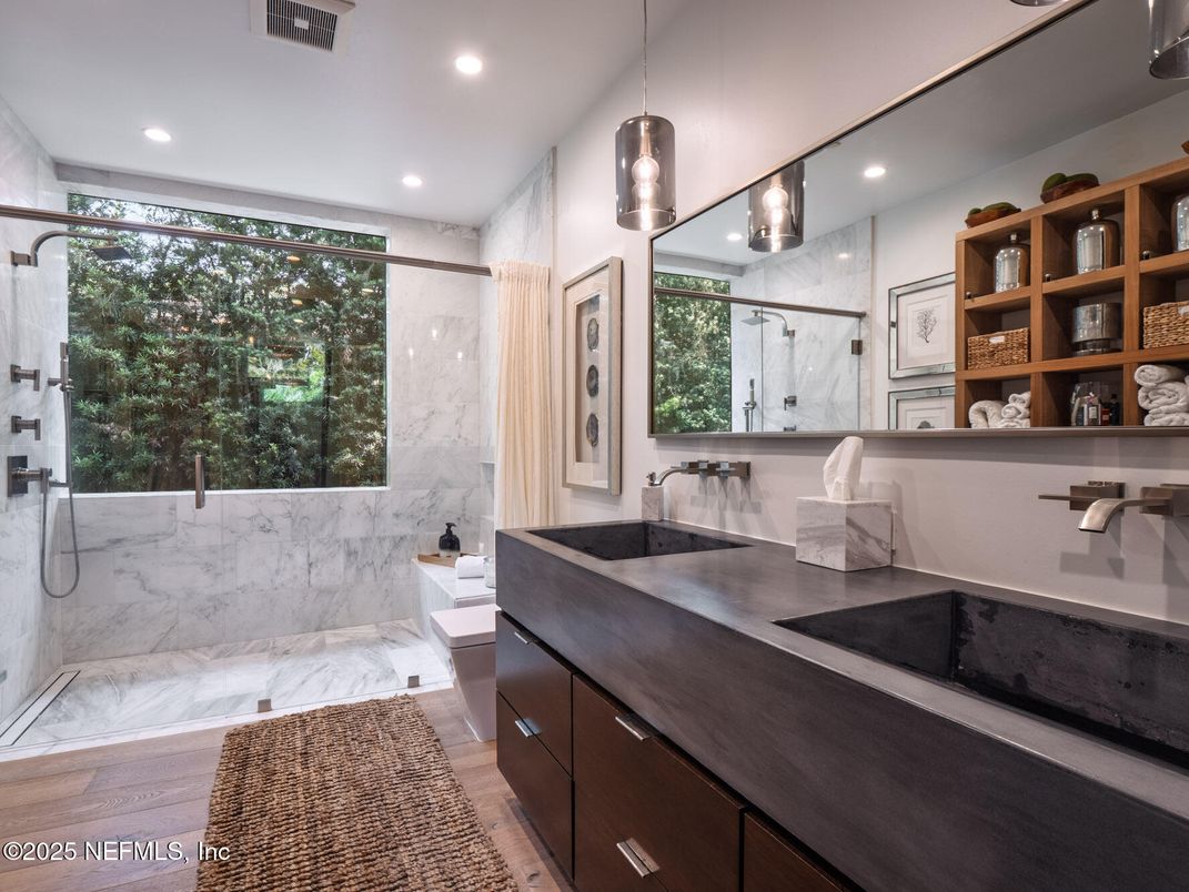 Bathroom, Dual Sink Vanities, Interior, Marble, Marble Walls, Pendant Lights, Recessed Lighting, Wood Texture Flooring