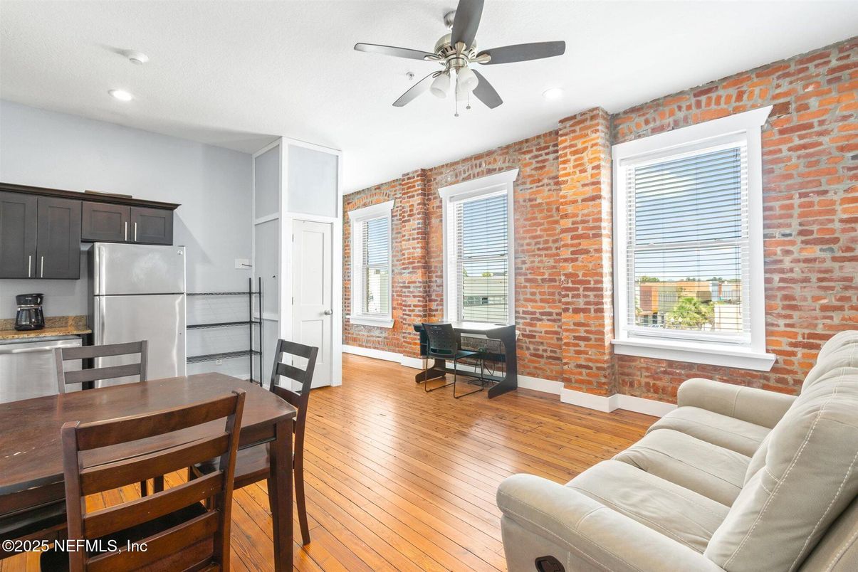 Dining room, Interior, Kitchen, Recessed Lighting, Stainless Steel Appliances, Stone Walls, Wood Texture Flooring