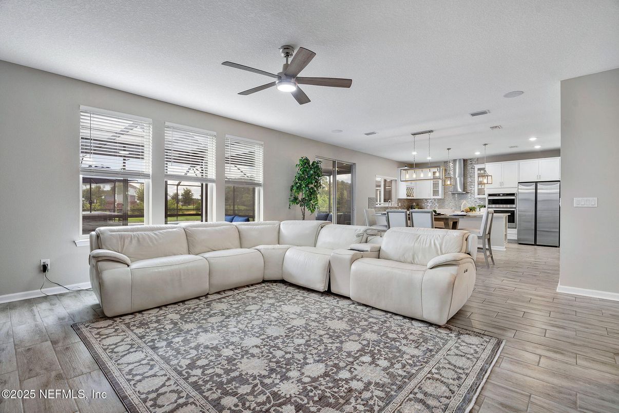 Dining room, Interior, Kitchen, Living room, Pendant Lights, Recessed Lighting, Stainless Steel Appliances, Wood Texture Flooring
