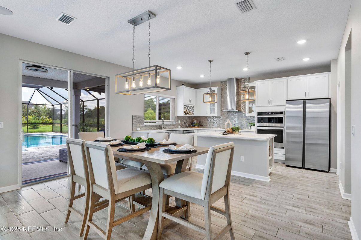 Dining room, Interior, Kitchen, Pendant Lights, Recessed Lighting, Stainless Steel Appliances, Wood Texture Flooring