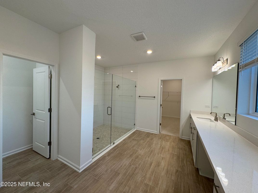 Bathroom, Dual Sink Vanities, Glass Shower, Interior, Recessed Lighting, Wood Texture Flooring