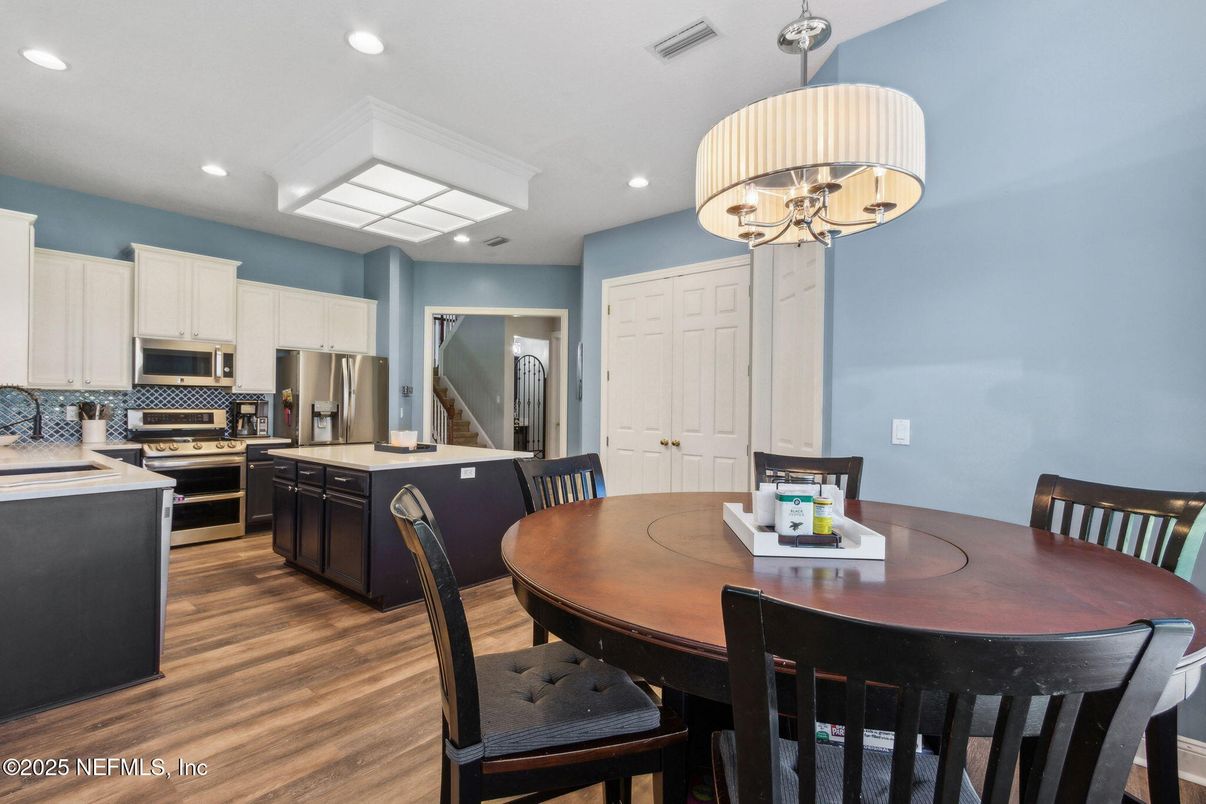 Chandelier, Dining room, Interior, Kitchen, Recessed Lighting, Stainless Steel Appliances, Wood Texture Flooring