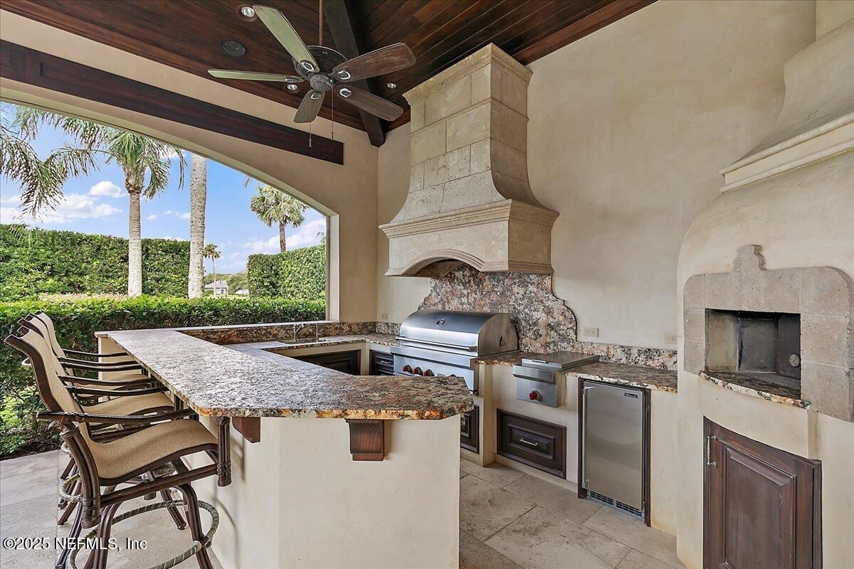 Exterior, Fireplace, Outdoor Kitchen