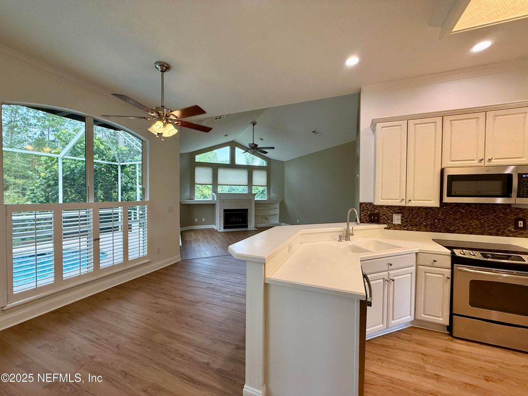 Fireplace, Interior, Kitchen, Recessed Lighting, Wood Texture Flooring