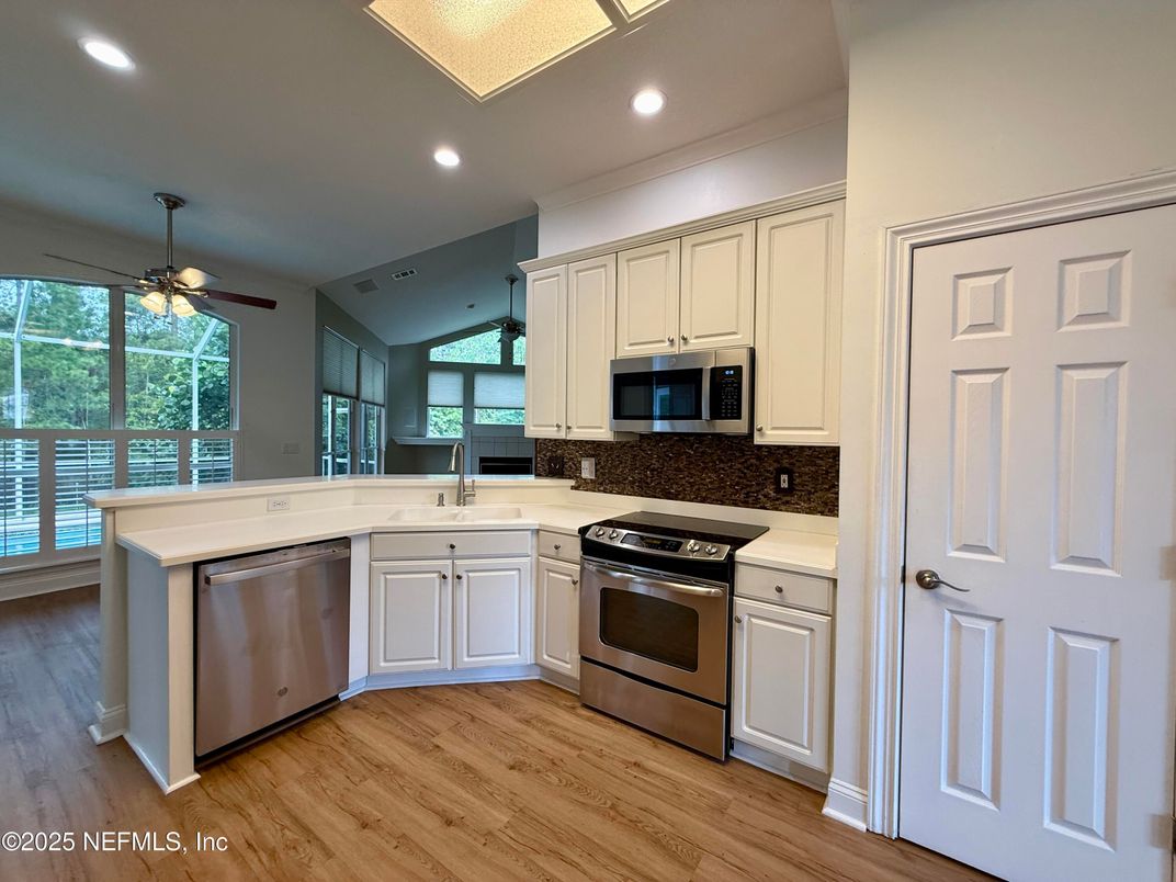 Interior, Kitchen, Recessed Lighting, Stainless Steel Appliances, Wood Texture Flooring