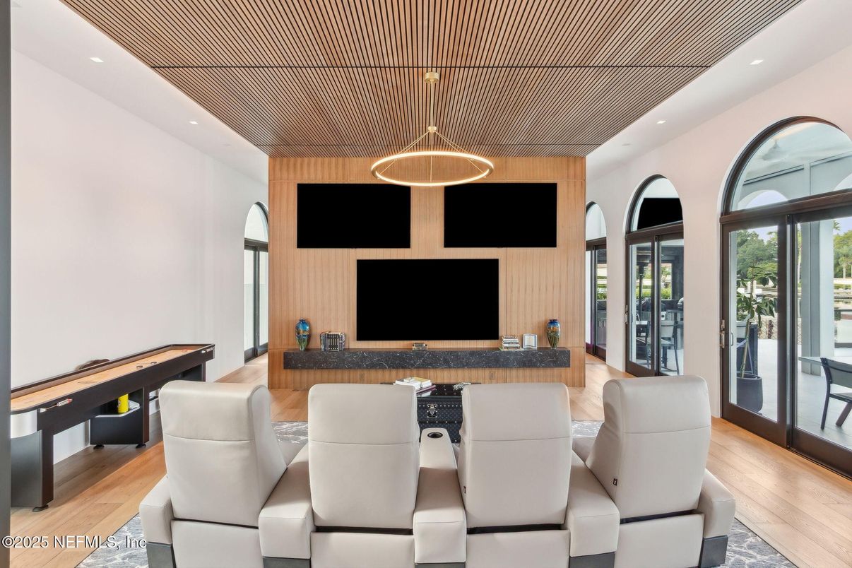 Home Theatre Room, Game Room, Interior, Living room, Pendant Lights, Recessed Lighting, Wood Texture Flooring, Wooden Walls
