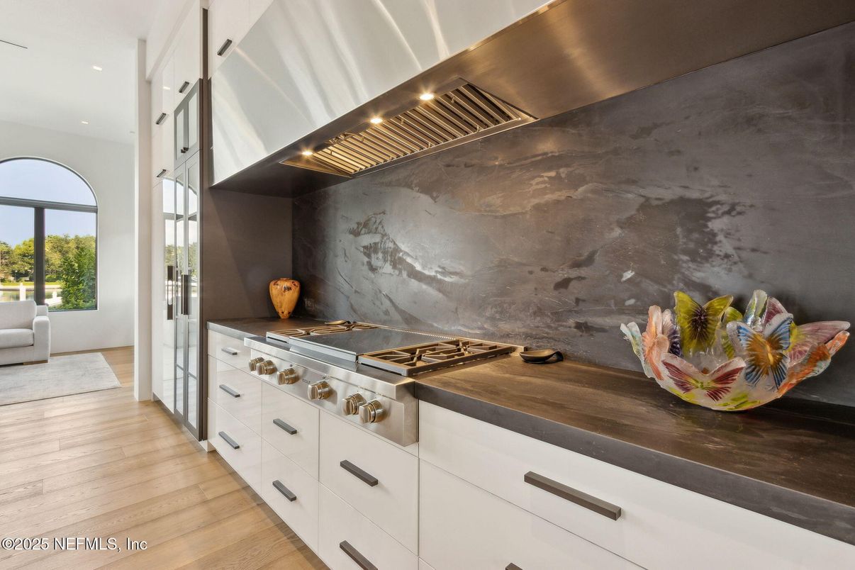 Interior, Kitchen, Marble Walls, Recessed Lighting, Stainless Steel Appliances, Wood Texture Flooring