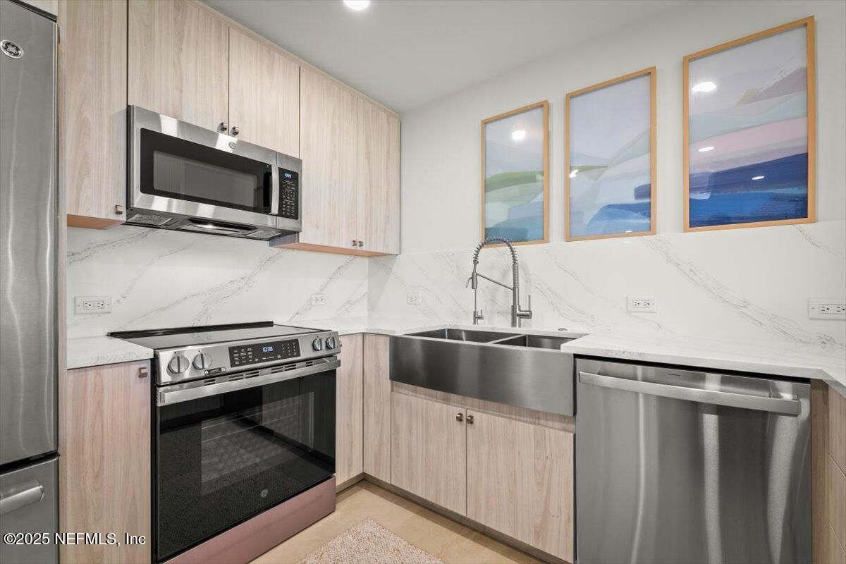 Interior, Kitchen, Marble Walls, Recessed Lighting, Stainless Steel Appliances