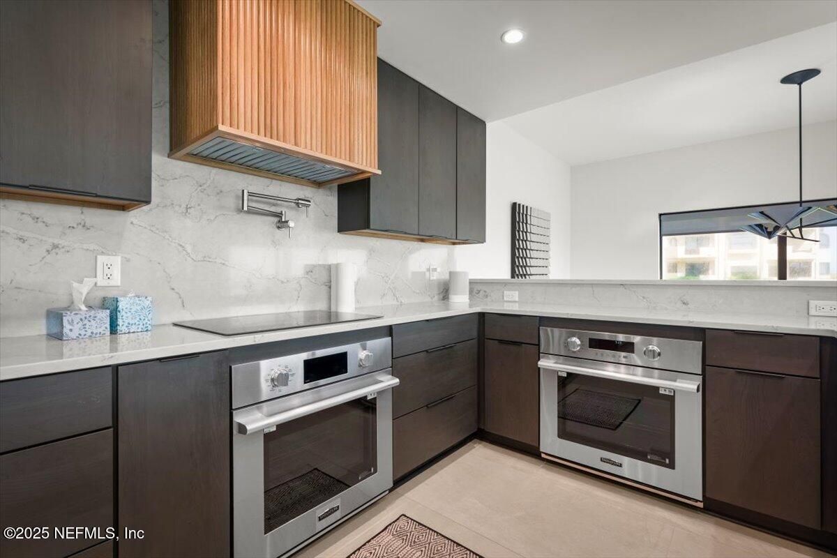 Interior, Kitchen, Marble Walls, Pendant Lights, Recessed Lighting, Stainless Steel Appliances
