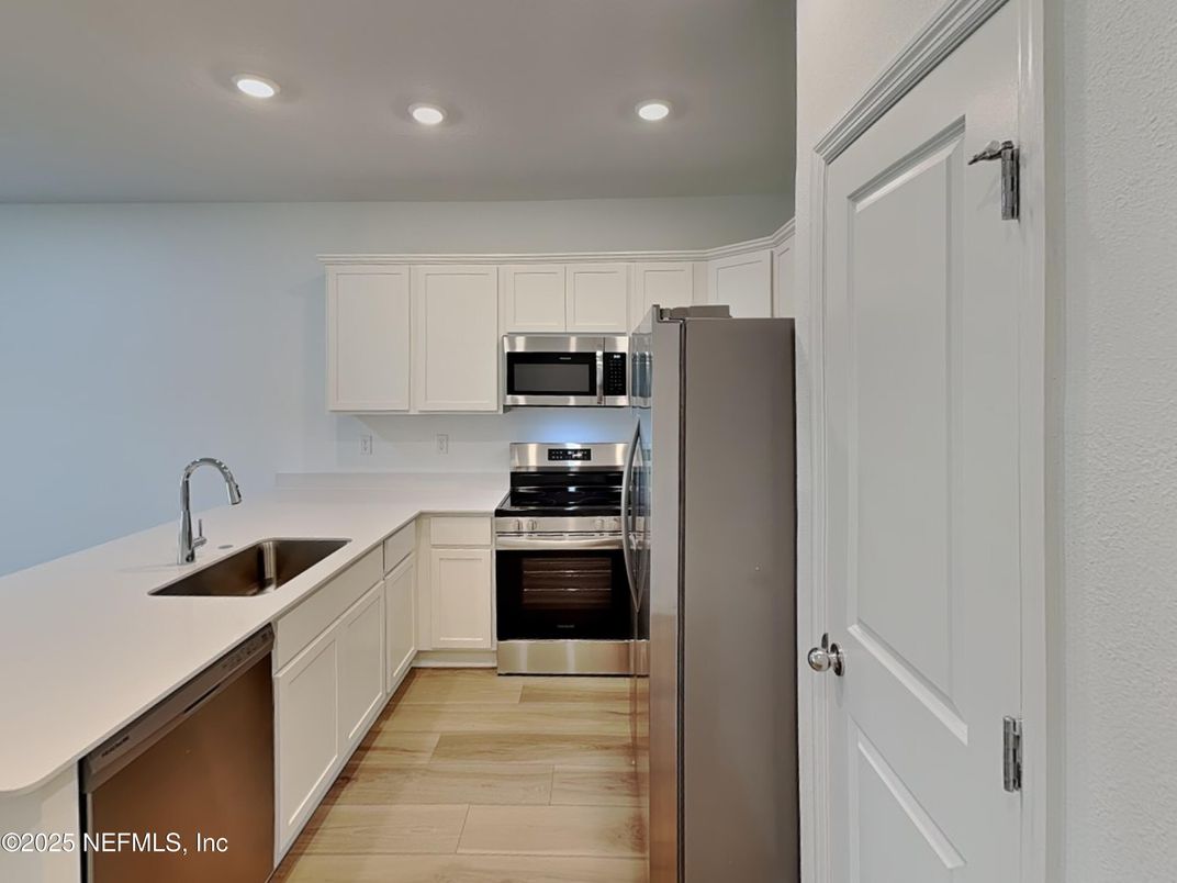 Interior, Kitchen, Recessed Lighting, Stainless Steel Appliances, Wood Texture Flooring