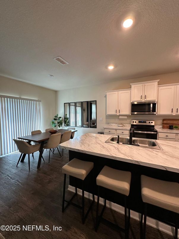 Dining room, Interior, Kitchen, Recessed Lighting, Stainless Steel Appliances, Wood Texture Flooring