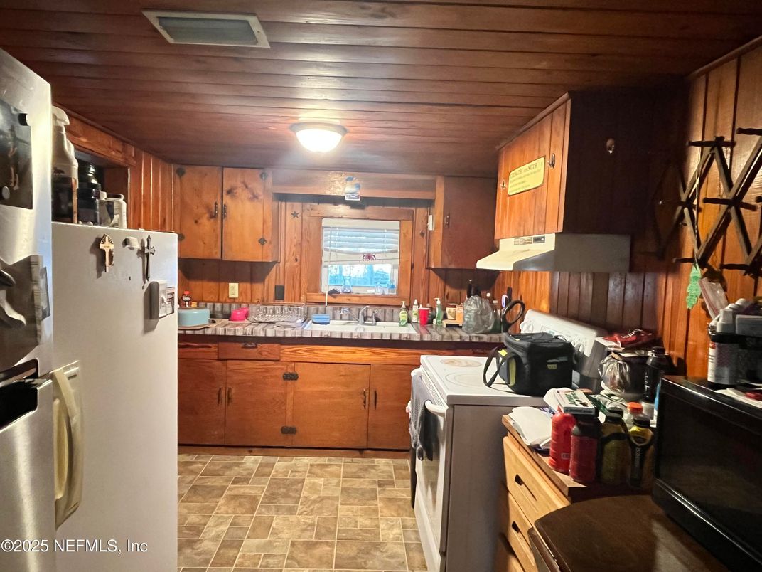 Interior, Kitchen, Tile Countertops, Washer, Wooden Ceilings, Wooden Walls