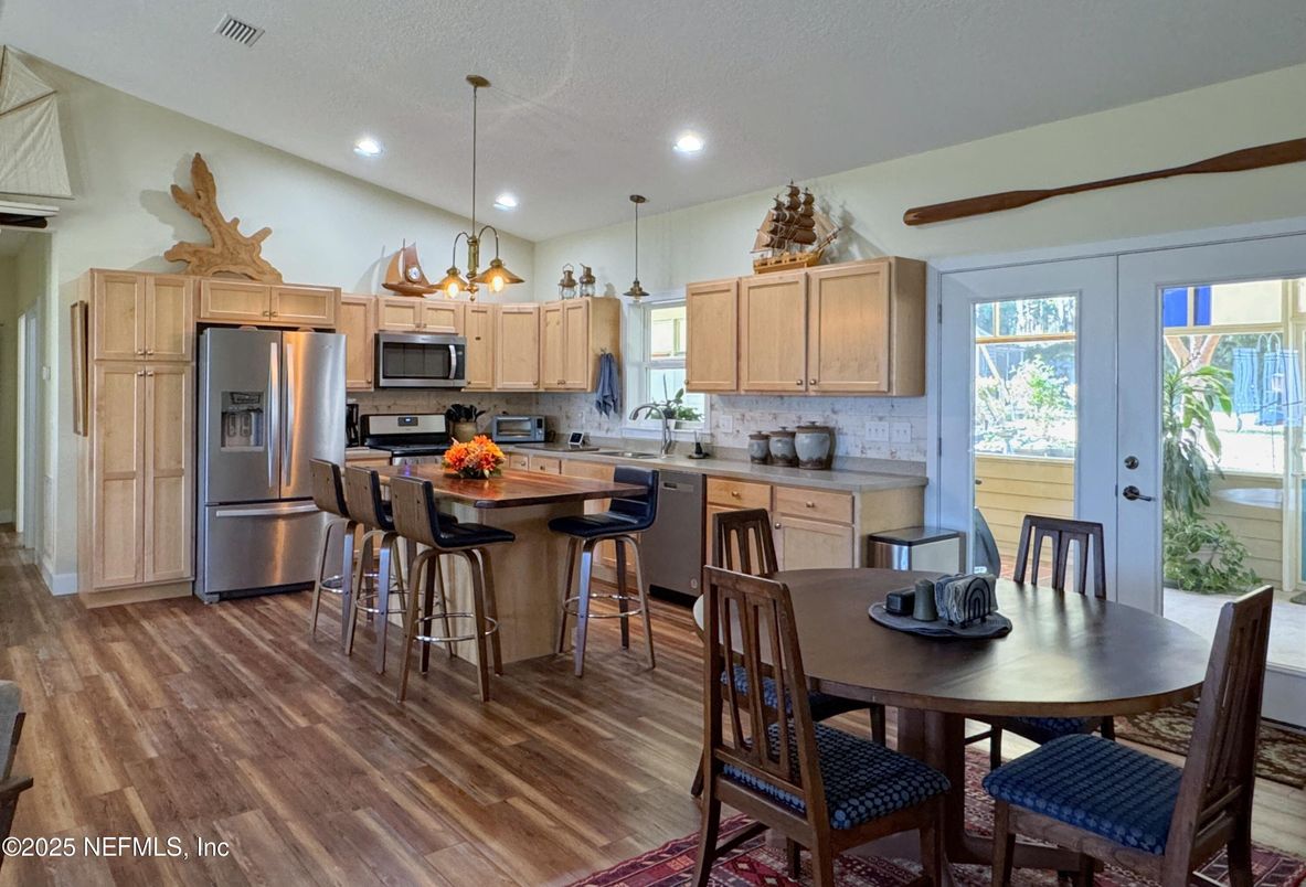 Dining room, Interior, Kitchen, Pendant Lights, Recessed Lighting, Stainless Steel Appliances, Wood Texture Flooring