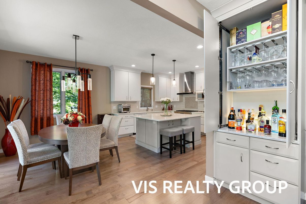Dining room, Interior, Kitchen, Pendant Lights, Recessed Lighting, Stainless Steel Appliances, Wood Texture Flooring