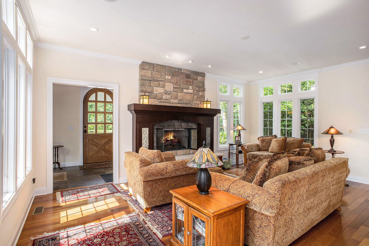 Fireplace, Interior, Living room, Recessed Lighting, Stone Walls, Wood Texture Flooring