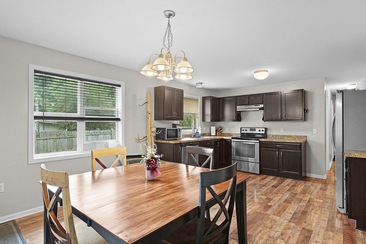 Chandelier, Dining room, Interior, Kitchen, Stainless Steel Appliances, Wood Texture Flooring