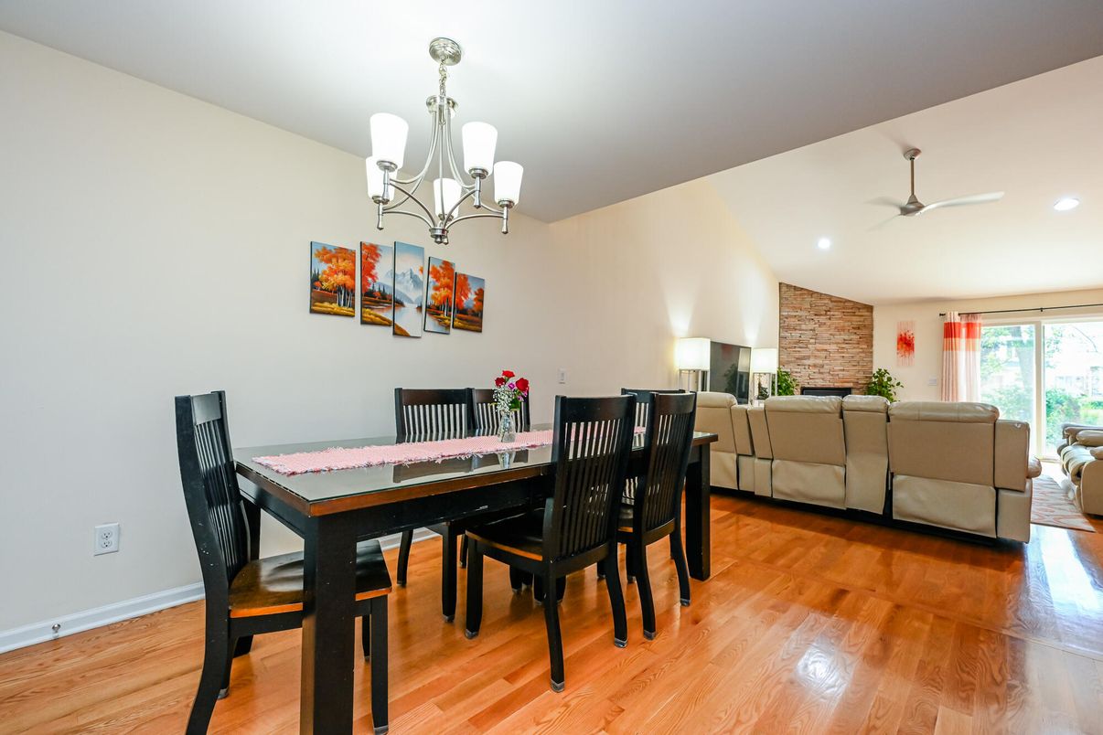 Chandelier, Dining room, Interior, Living room, Recessed Lighting, Stone Walls, Wood Texture Flooring