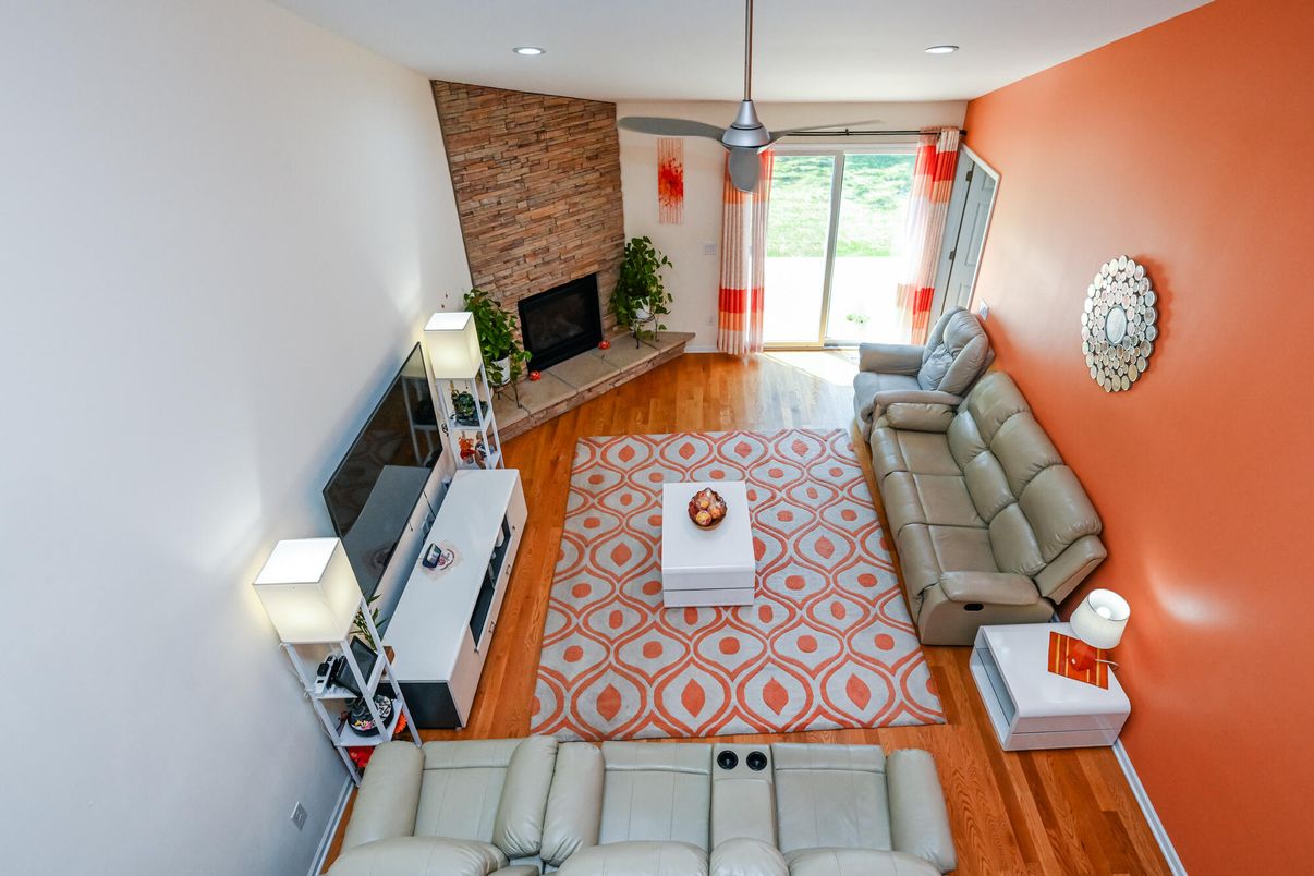 Fireplace, Interior, Living room, Pendant Lights, Recessed Lighting, Stone Walls, Wood Texture Flooring