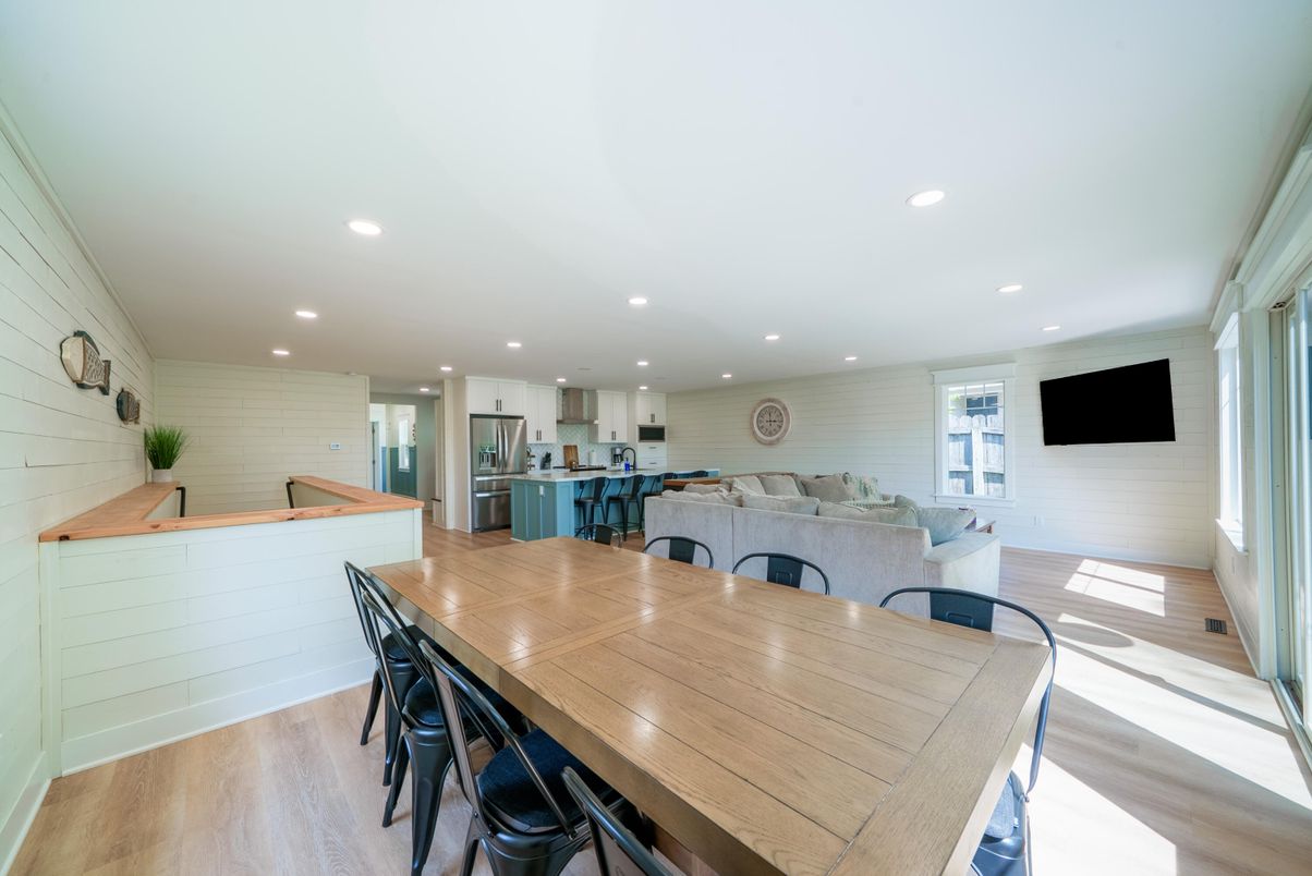 Dining room, Interior, Kitchen, Living room, Recessed Lighting, Stainless Steel Appliances, Stone Walls, Wood Texture Flooring