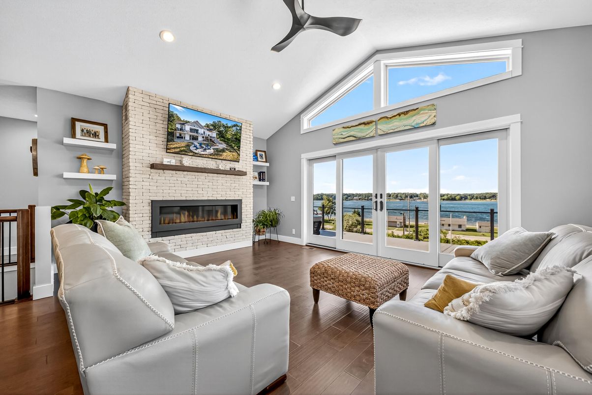 Fireplace, Interior, Living room, Recessed Lighting, Stone Walls, Water, Wood Texture Flooring