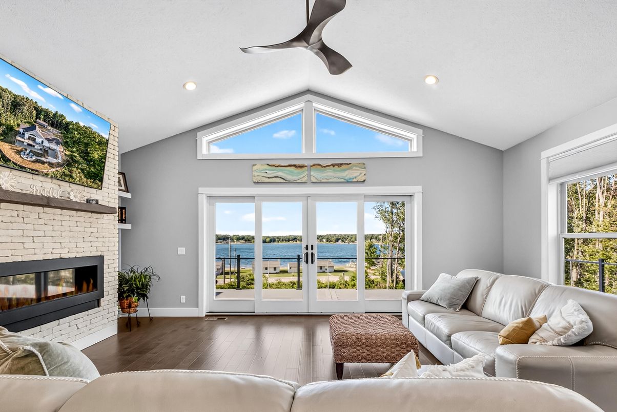 Fireplace, Interior, Living room, Recessed Lighting, Stone Walls, Water, Wood Texture Flooring