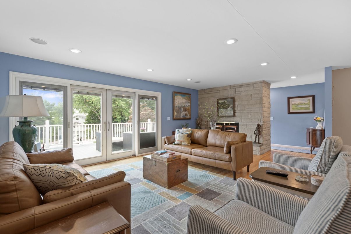 Fireplace, Interior, Living room, Recessed Lighting, Stone Walls, Wood Texture Flooring