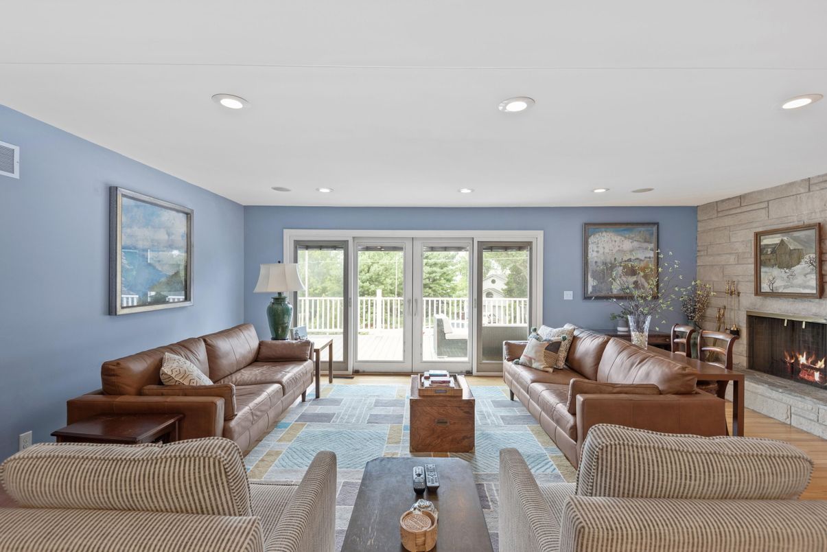 Fireplace, Interior, Living room, Recessed Lighting, Stone Walls, Wood Texture Flooring