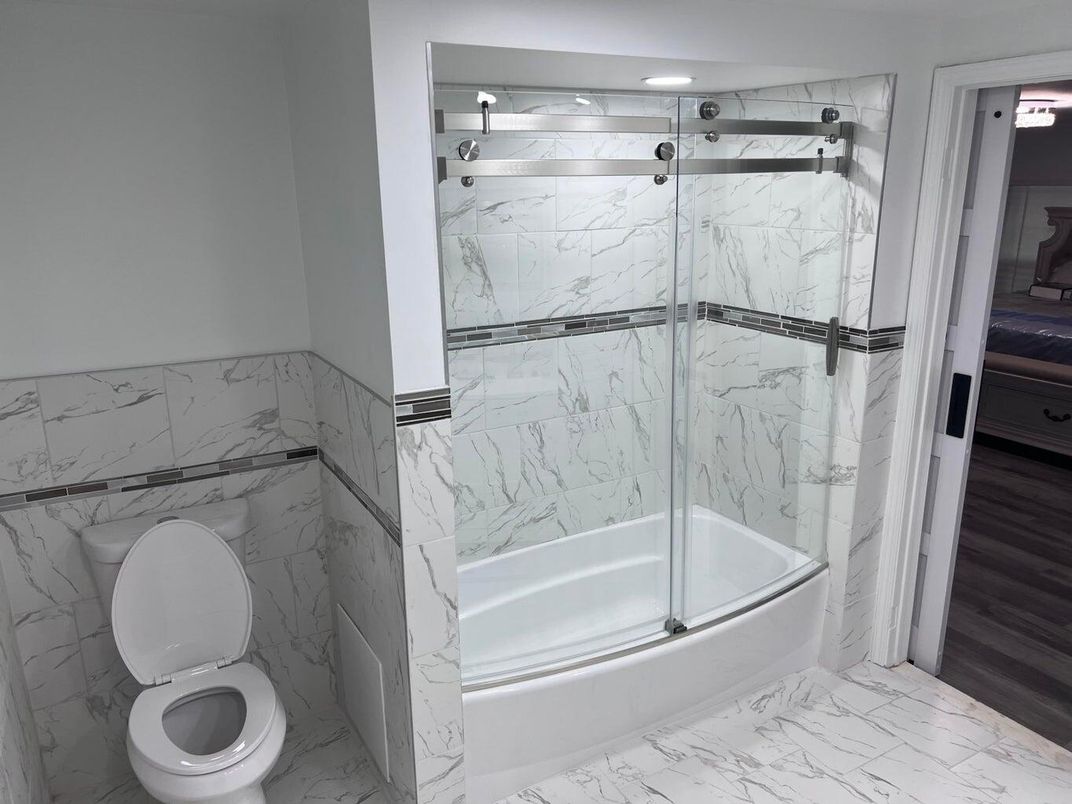 Bathroom, Glass Shower, Interior, Marble, Marble Walls, Recessed Lighting, Wood Texture Flooring
