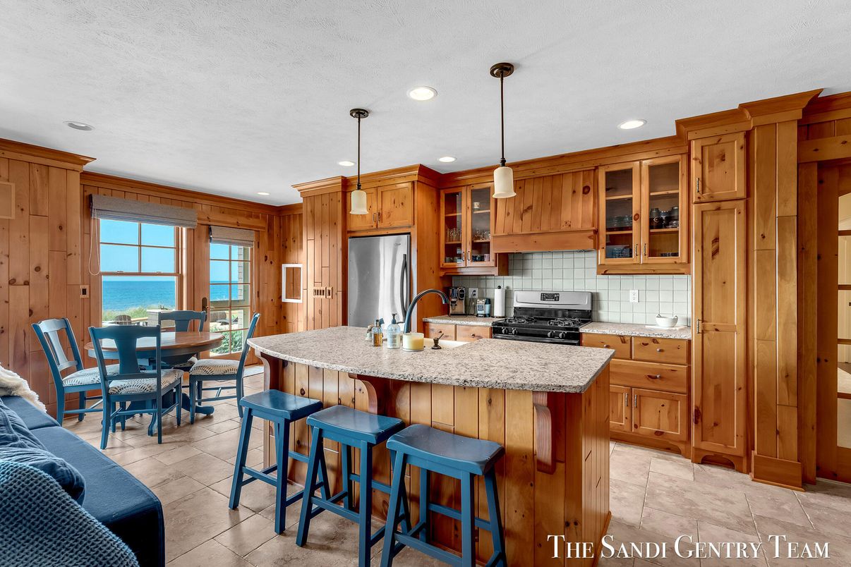 Dining room, Interior, Kitchen, Pendant Lights, Recessed Lighting, Stainless Steel Appliances, Water, Wooden Walls