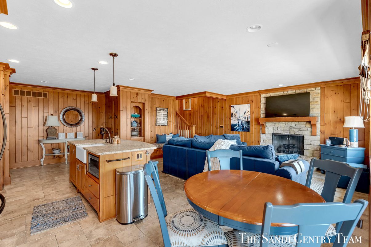 Dining room, Fireplace, Interior, Kitchen, Living room, Pendant Lights, Recessed Lighting, Stainless Steel Appliances, Wooden Walls