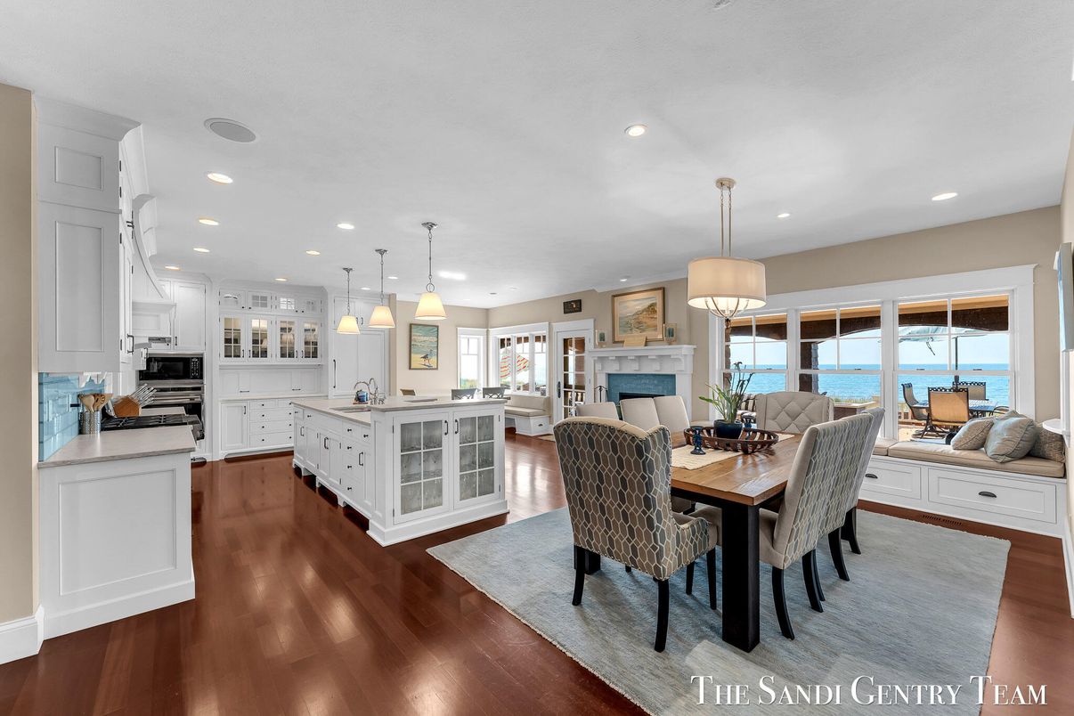 Dining room, Fireplace, Interior, Kitchen, Pendant Lights, Recessed Lighting, Stainless Steel Appliances, Water, Wood Texture Flooring