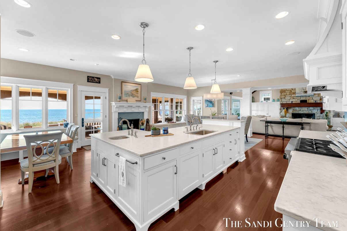 Dining room, Fireplace, Interior, Kitchen, Living room, Pendant Lights, Recessed Lighting, Water, Wood Texture Flooring