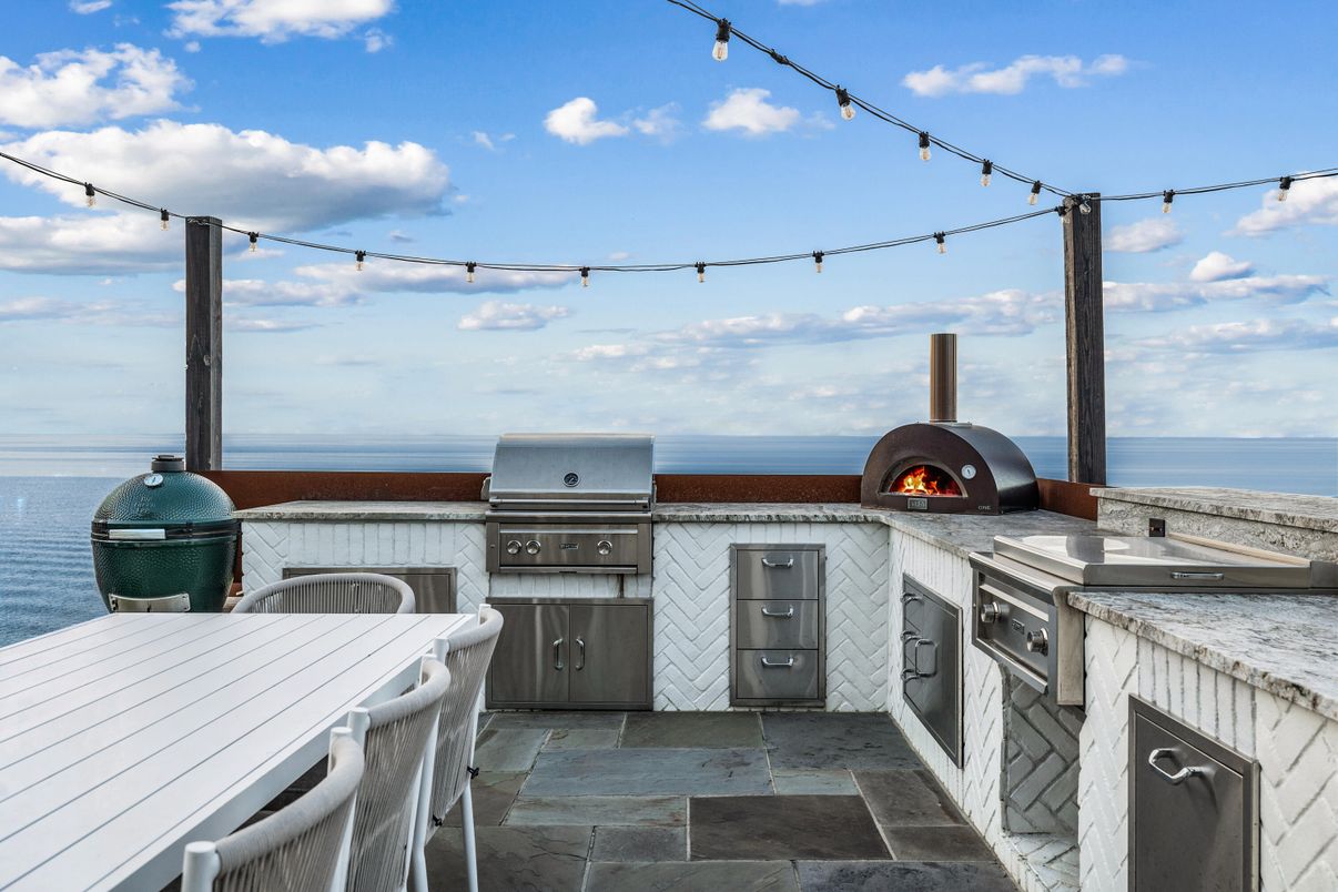 Exterior, Fireplace, Outdoor Kitchen, Water