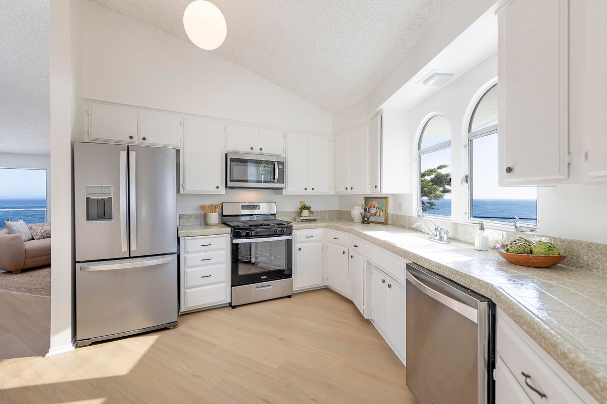 Interior, Kitchen, Stainless Steel Appliances, Tile Countertops, Water, Wood Texture Flooring