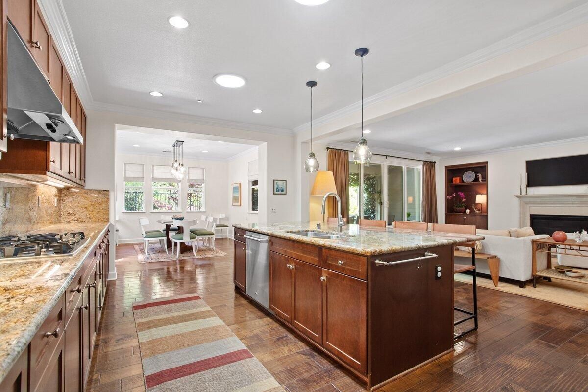 Dining room, Fireplace, Interior, Kitchen, Living room, Pendant Lights, Recessed Lighting, Stainless Steel Appliances, Wood Texture Flooring