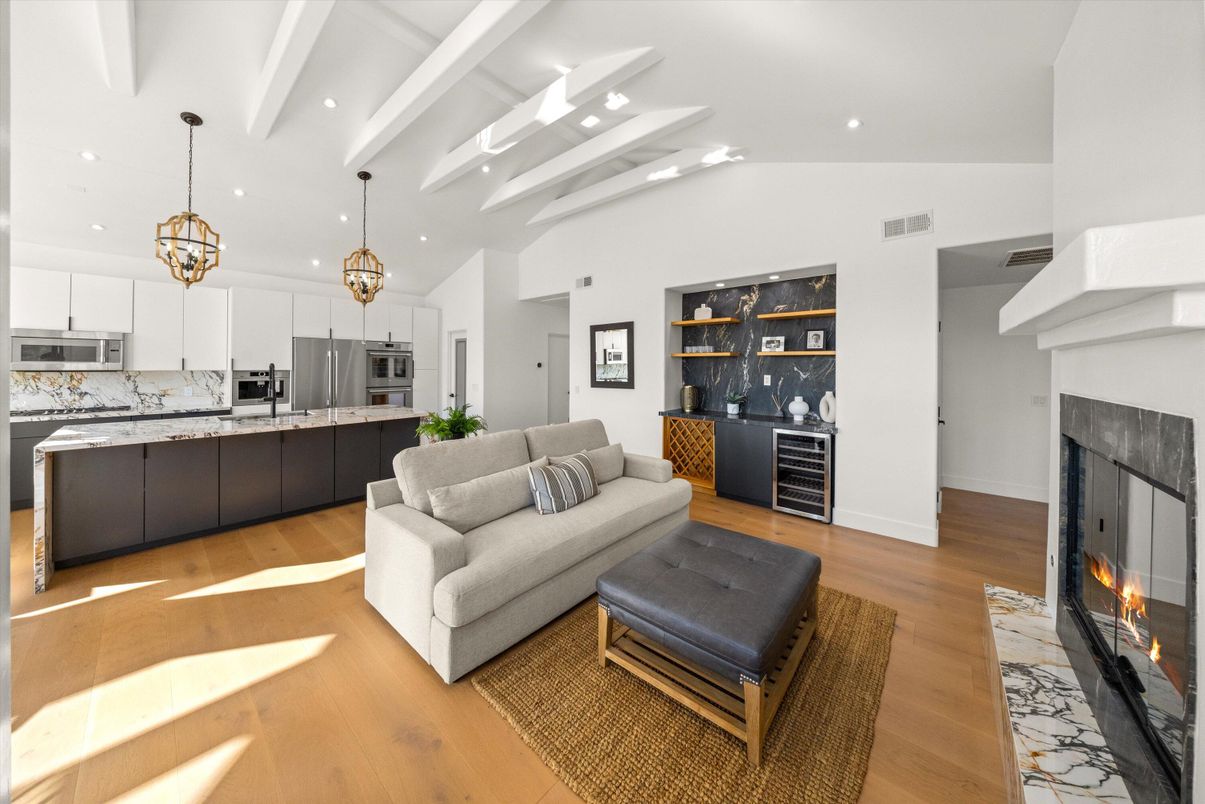 Fireplace, Interior, Kitchen, Living room, Pendant Lights, Recessed Lighting, Stainless Steel Appliances, Wood Texture Flooring