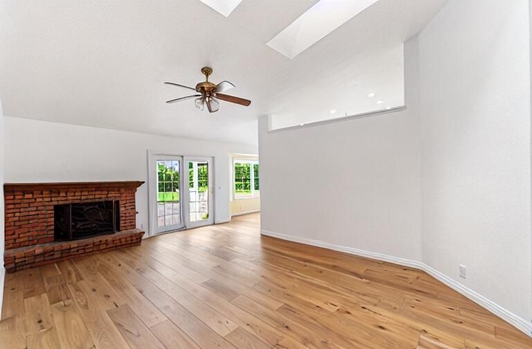 Empty room, Fireplace, Interior, Recessed Lighting, Stone Walls, Wood Texture Flooring