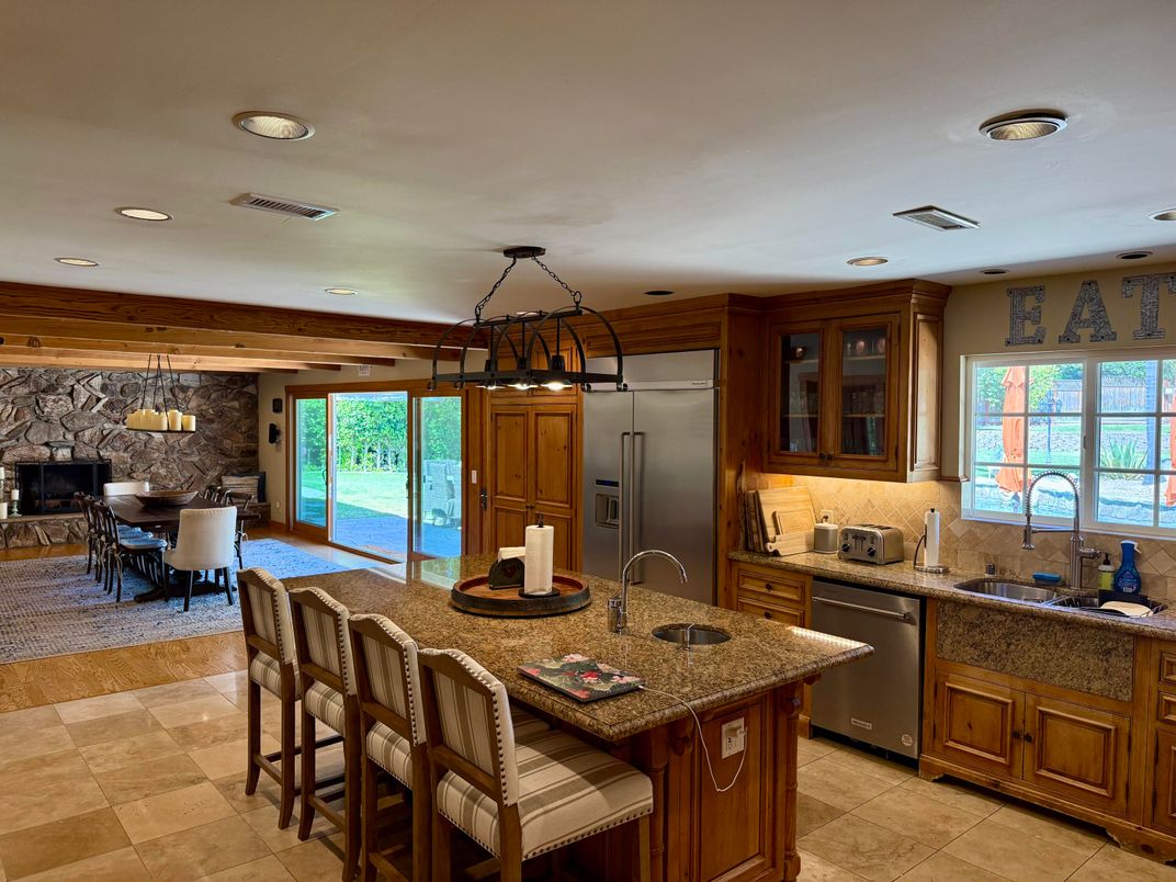 Dining room, Fireplace, Interior, Kitchen, Pendant Lights, Recessed Lighting, Stainless Steel Appliances, Stone Walls