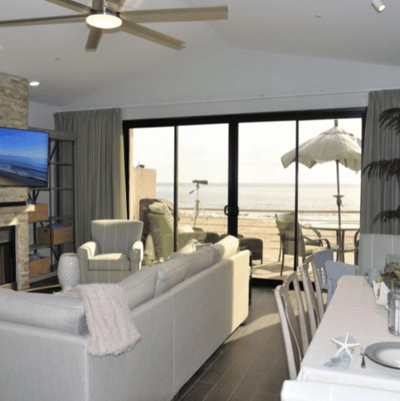 Dining room, Fireplace, Interior, Living room, Recessed Lighting, Stone Walls, Water, Wood Texture Flooring