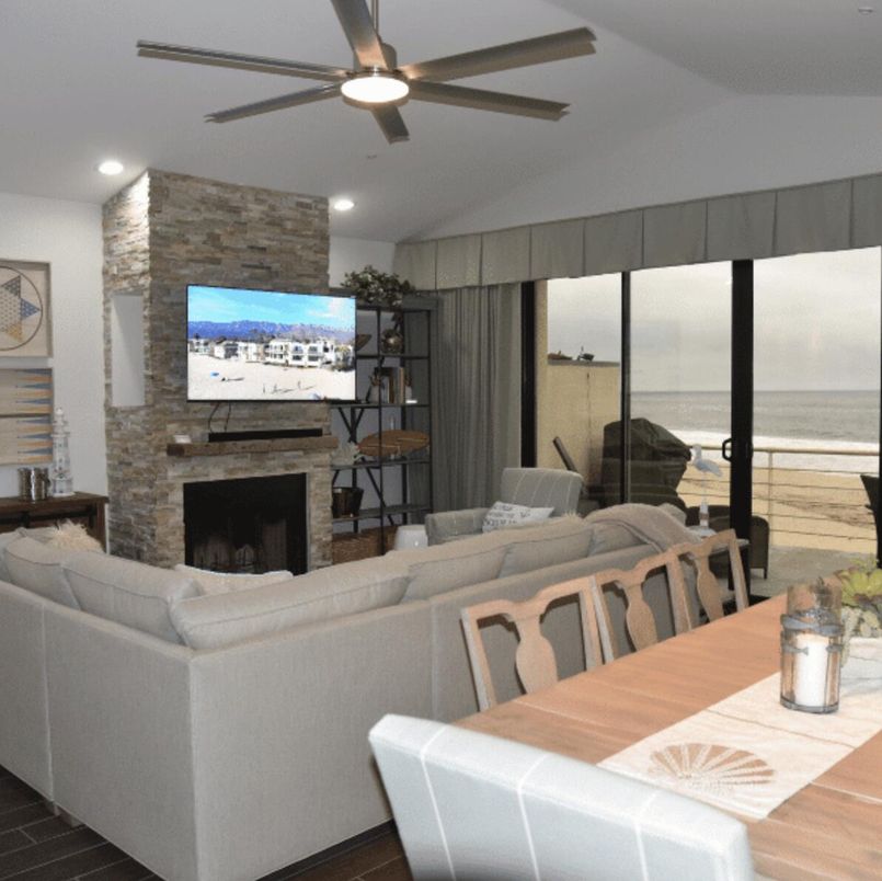 Dining room, Fireplace, Interior, Living room, Recessed Lighting, Stone Walls, Water, Wood Texture Flooring
